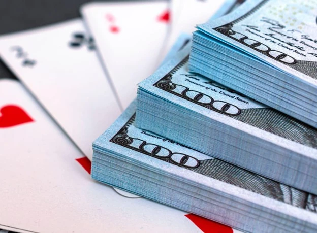 Canfield Solitaire rules limit the chances of winning, making it an ideal gambling game - as depicted in the photo above.
