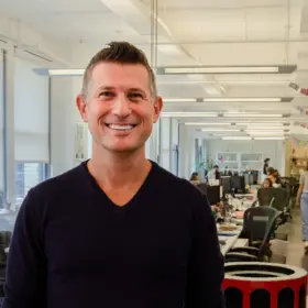 A picture of Arkadium CEO and co-founder Kenny Rosenblatt standing in the Arkadium office
