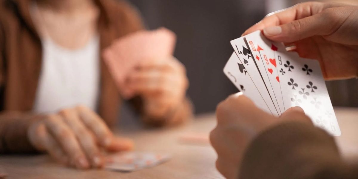 Playing Solitaire Socially: Is It Possible?